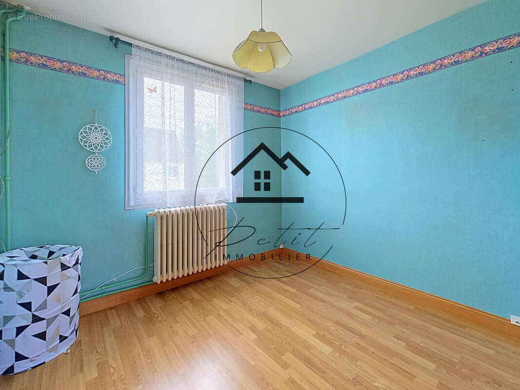 Maison familiale de 107 m2 avec 4 chambres et sous-sol total - photo 8