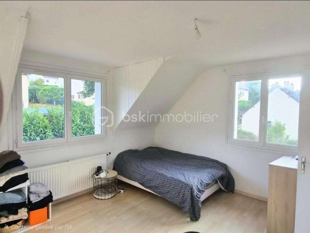 Une maison aux nombreux atouts, offrant espace, luminosité et une terrasse à aménager - photo 8