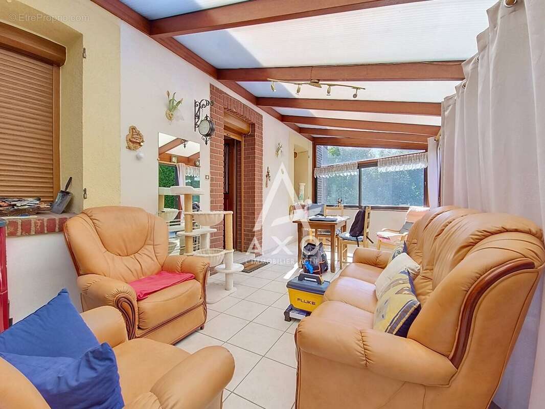 Maison en brique à Auneuil avec 2 chambres, véranda et jardin clos - photo 3