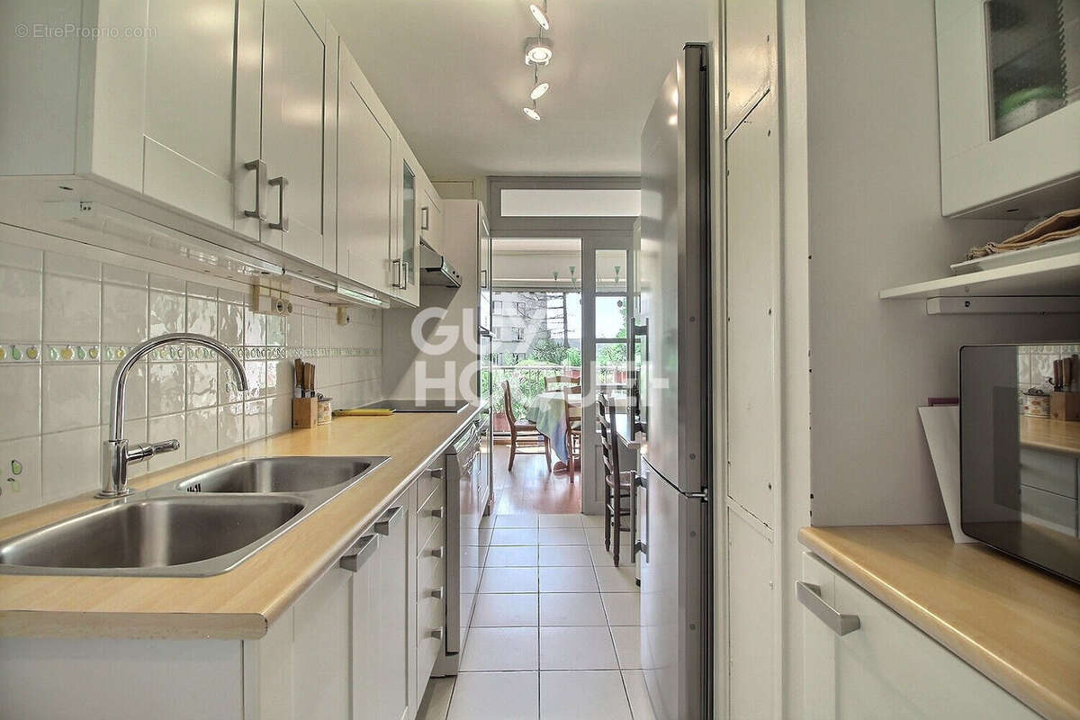 Appartement 4 pièces de 94 m² en rez-de-jardin - photo 5
