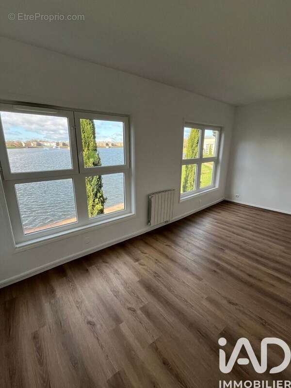 Photo 3 - Appartement à VOISINS-LE-BRETONNEUX