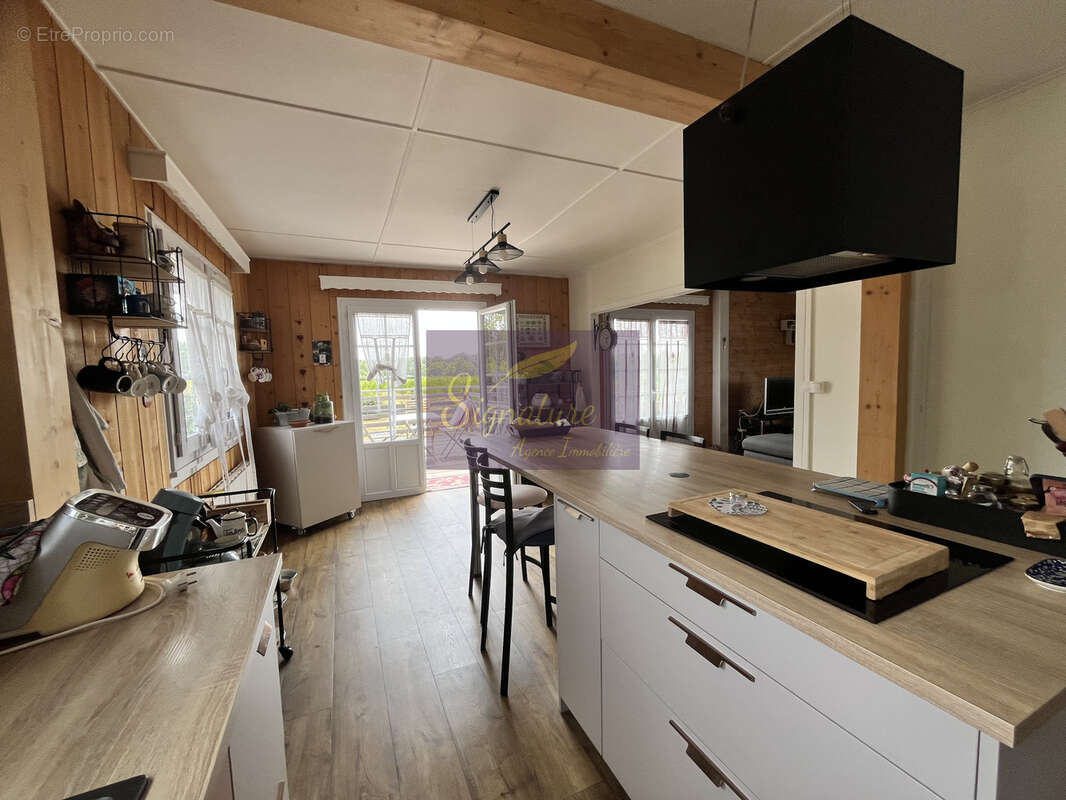Maison familiale en ossature bois de 145 m2, quatre chambres.  Terrain de 1824 m2 garage double. - photo 6