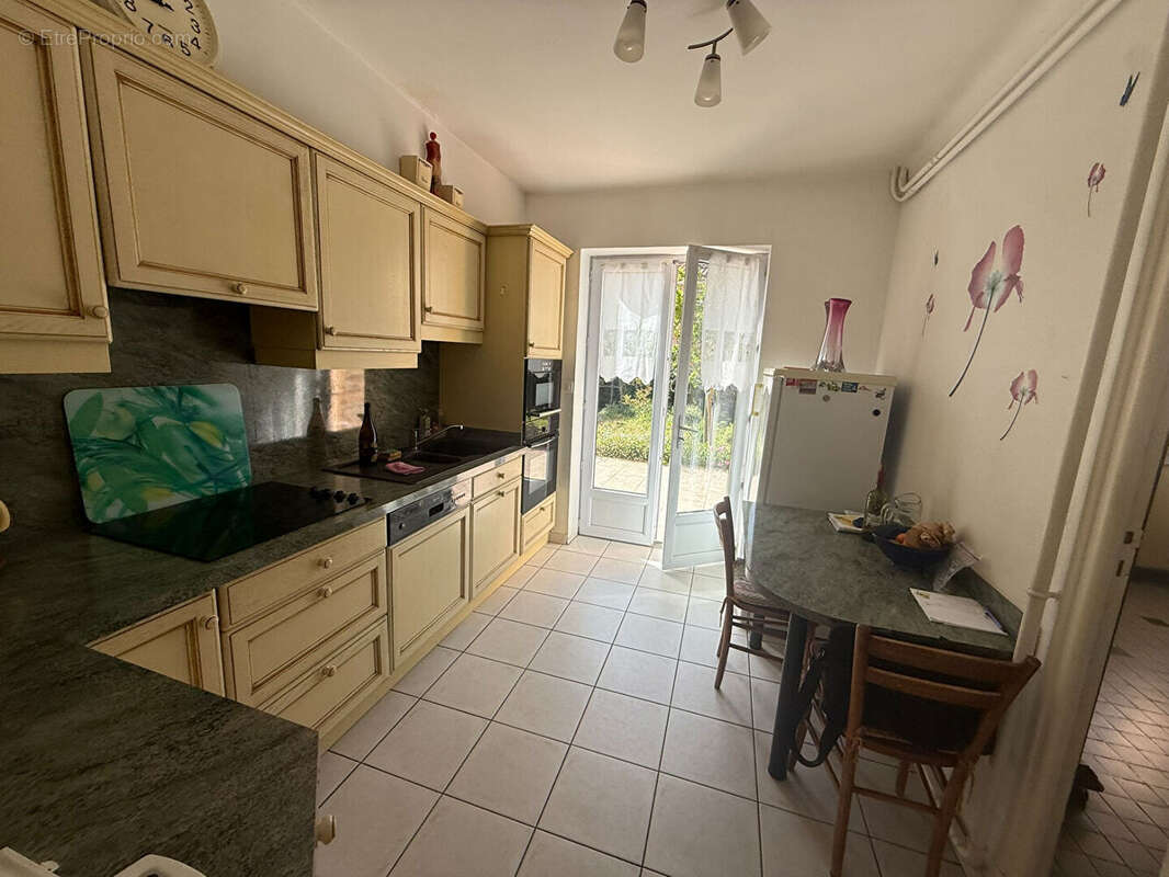 Maison familiale de 105 m² avec 4 chambres, garage motorisé et jardin à Grazailles - photo 6