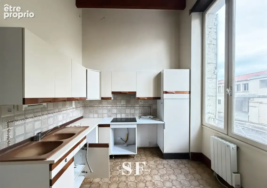 Rive gauche, immeuble de caractere appartement et local commercial - photo 9