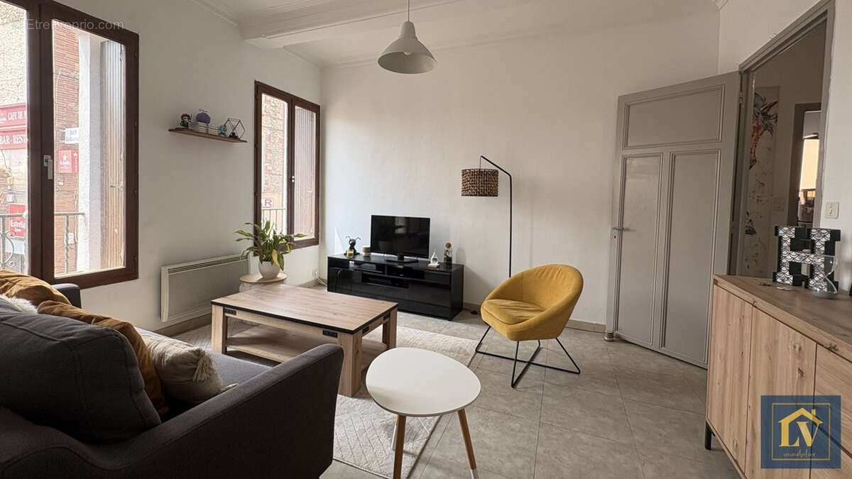Immeuble de rapport comprenant un local commercial et 4 appartements - photo 3