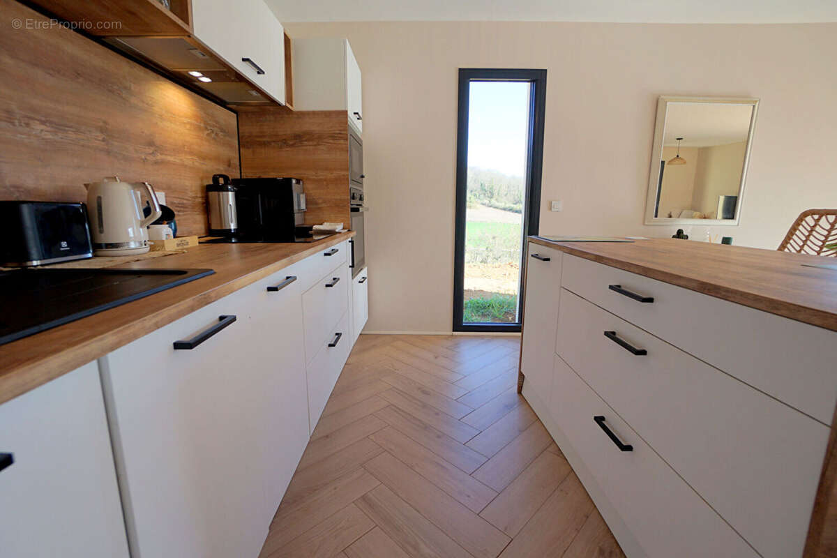 Maison à AUBERGENVILLE