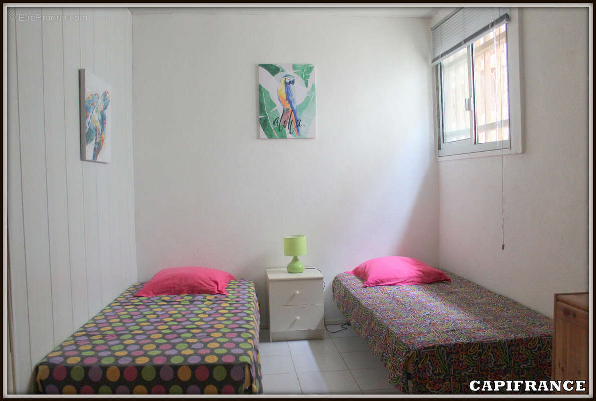 A vendre a kourou (97310) une magnifique maison en bois t5 de 106 m² avec 2 maisons t2 independantes - terrain de 775 m² - au pr - photo 11