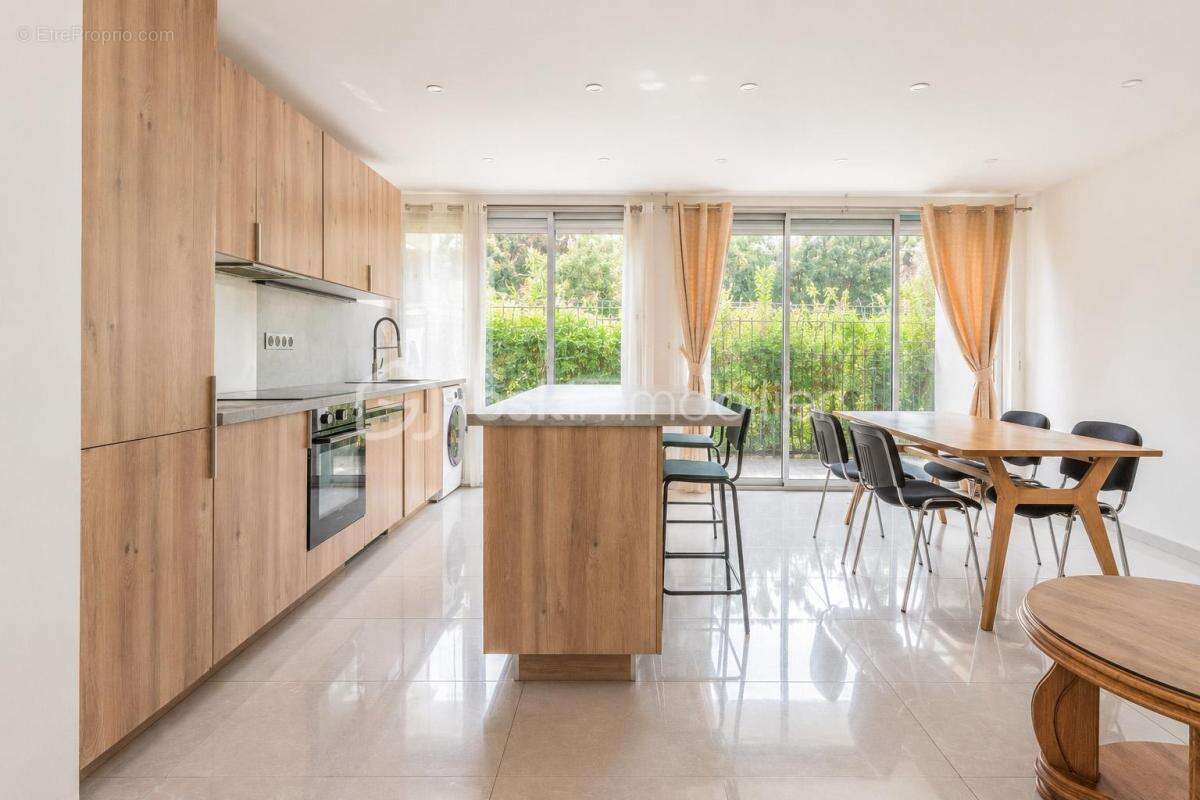 Appartement T3 en rez-de jardin avec loggia - photo 2