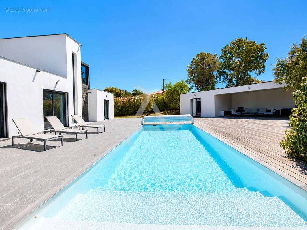 Villa t7 de 211m2 contemporaine avec piscine sous-sol aménagé et chambre indépendante - photo 5
