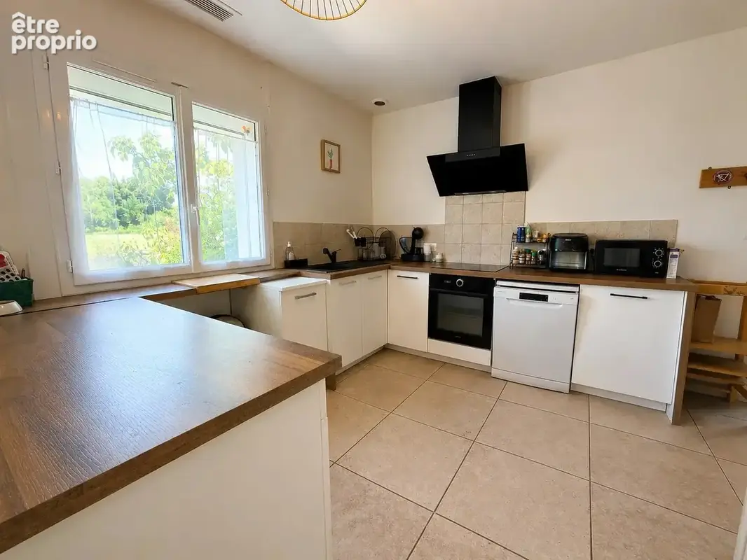 Maison de plain-pied de 115 m² avec garage et jardin - photo 4