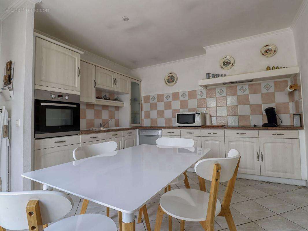 Maison de plain-pied de 110 m² - 3 chambres - Garage - Véranda -Terrain de 682 m² - photo 7